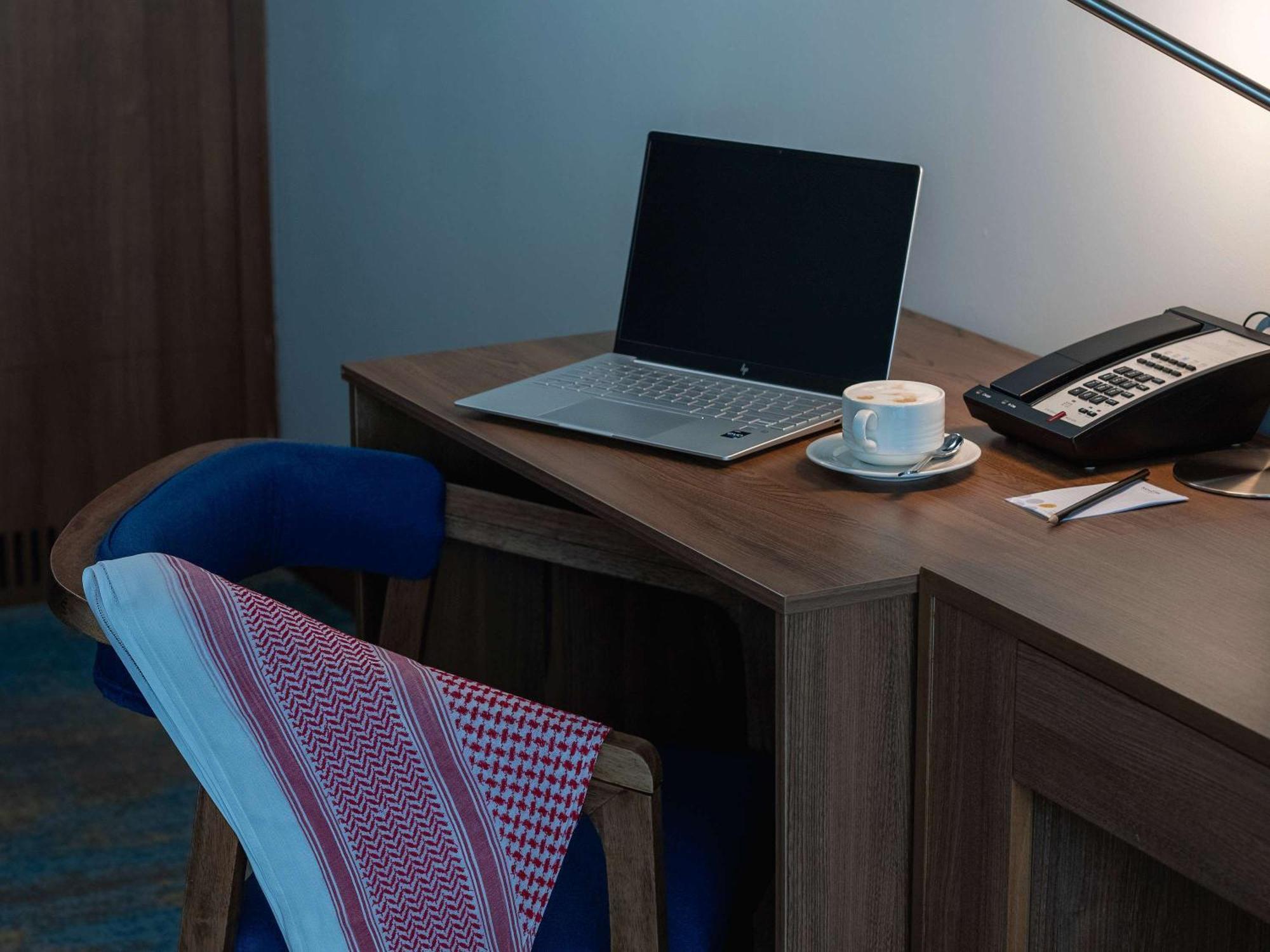 Novotel Jazan Exterior photo A laptop on a desk